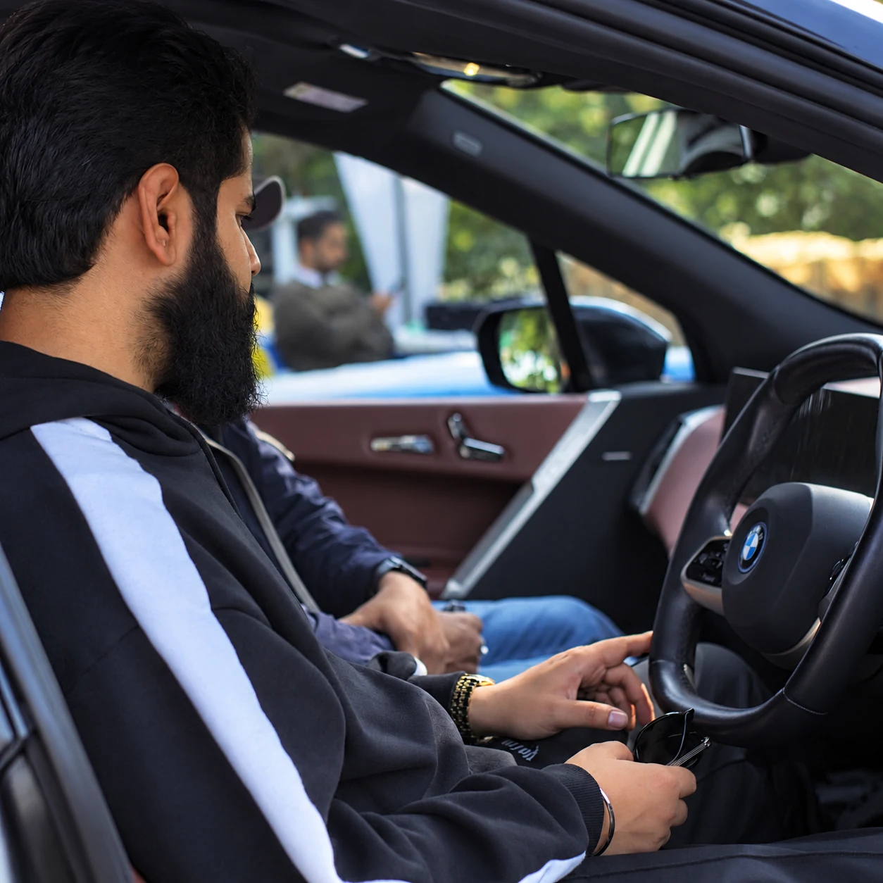 A guest seated inside a BMW at the CII Jharkhand Golf Cup