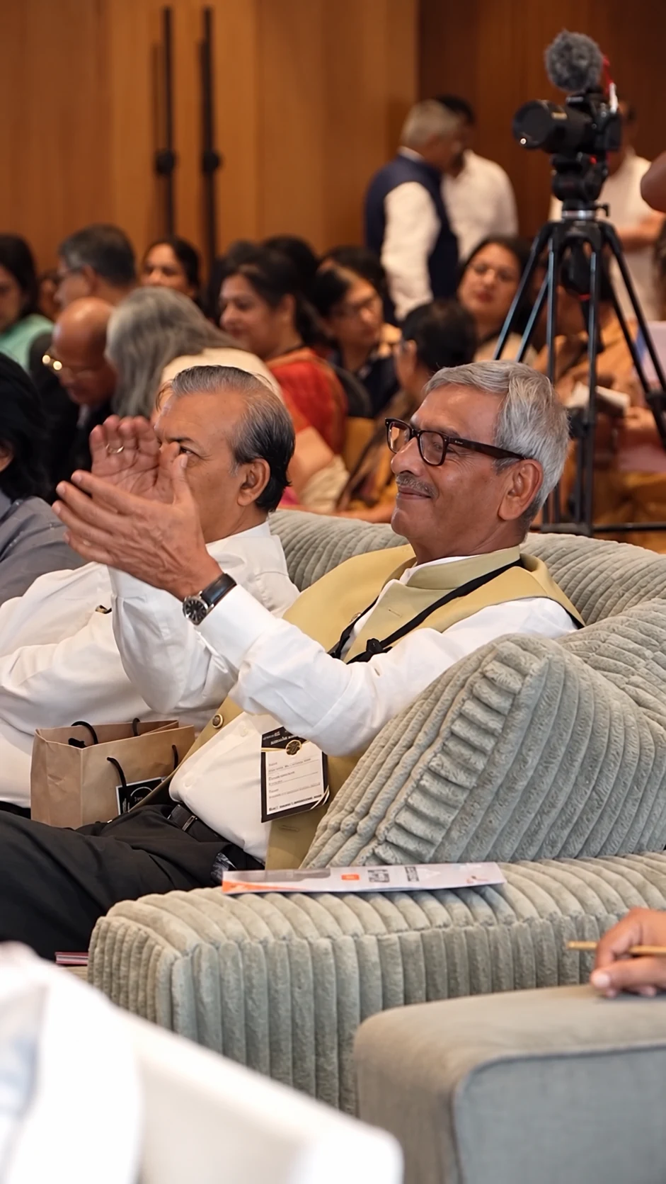 Guests applauding during the Rotary awards while seated in upholstered Ashley armchairs